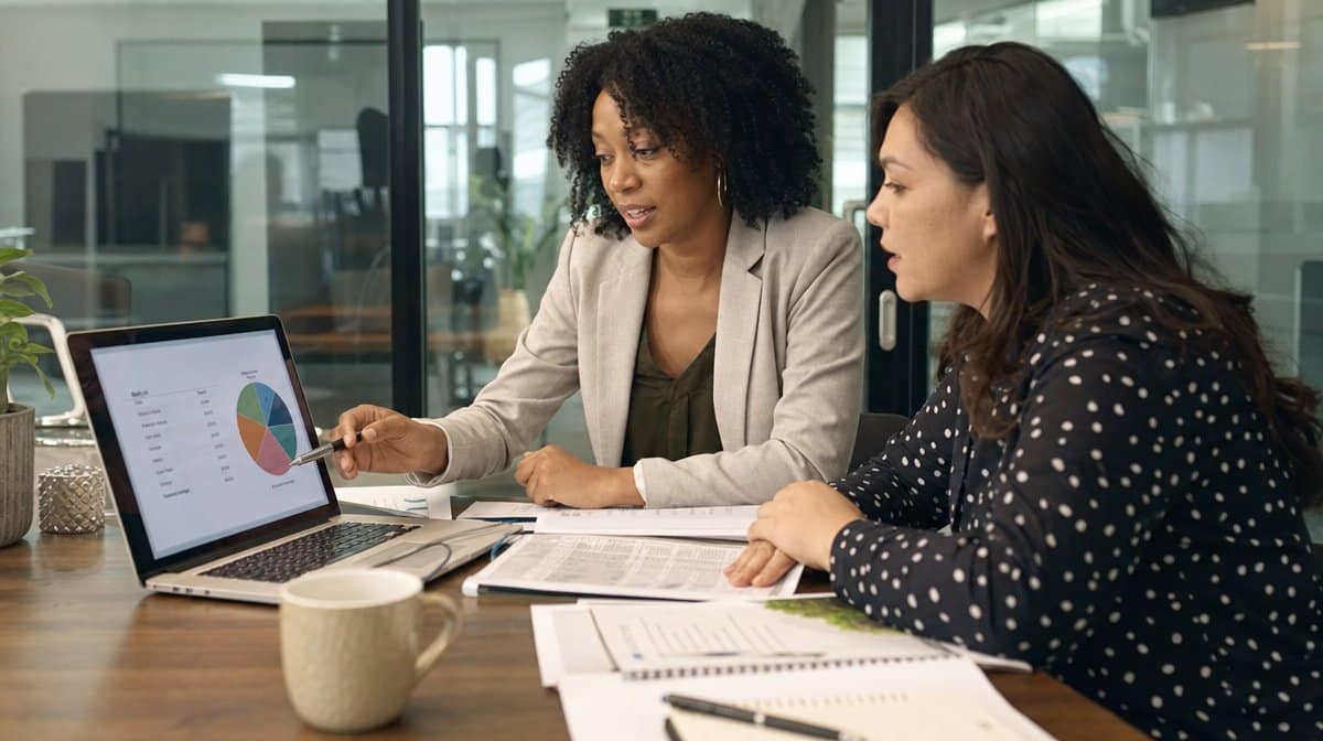 Financial mentor reviewing diversified portfolio choices with a woman investor